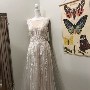 Size 8, Wedding Dress, with extra length. Never worn, with veil and belt.